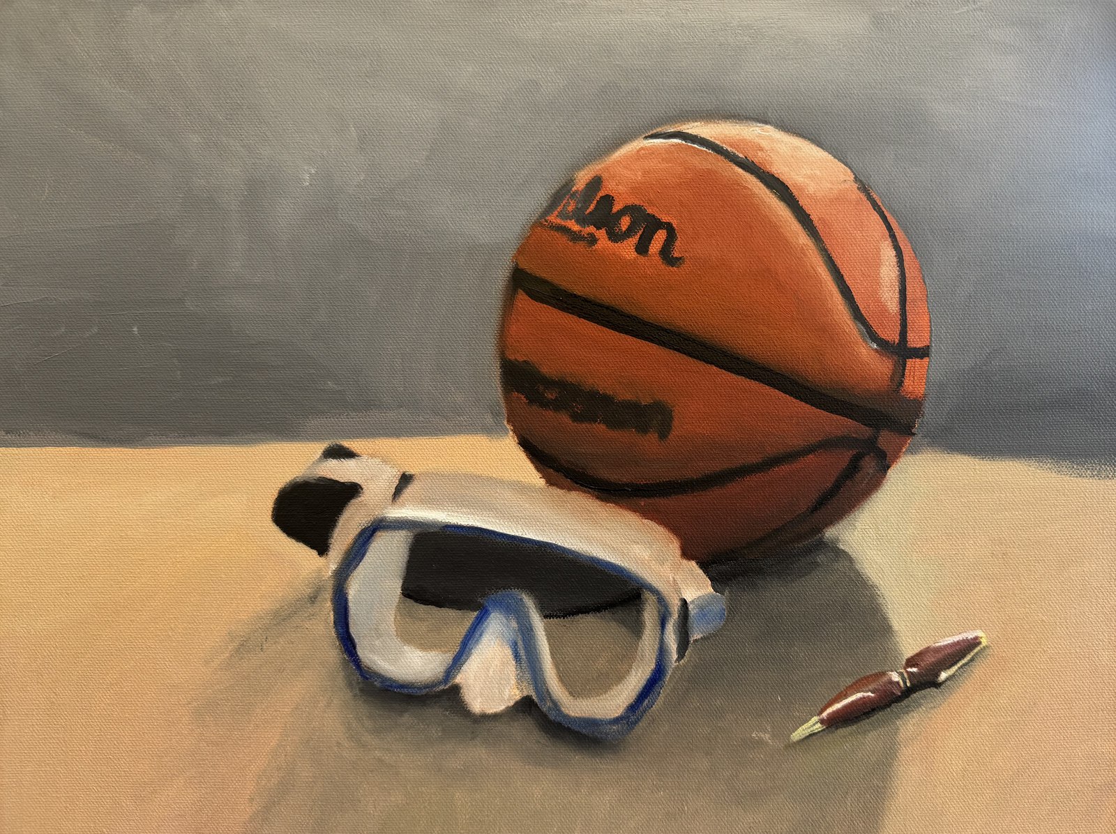 Still life self-portrait: a basketball, a dive mask and a pen