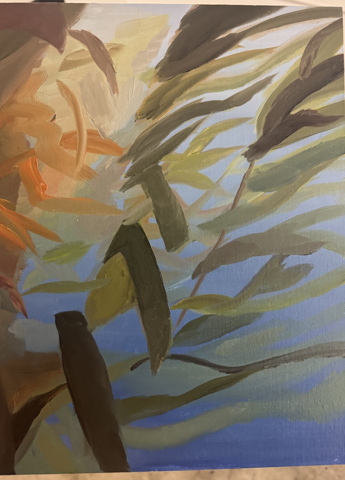 Kelp study: kelp fronds and orange fish in blue water